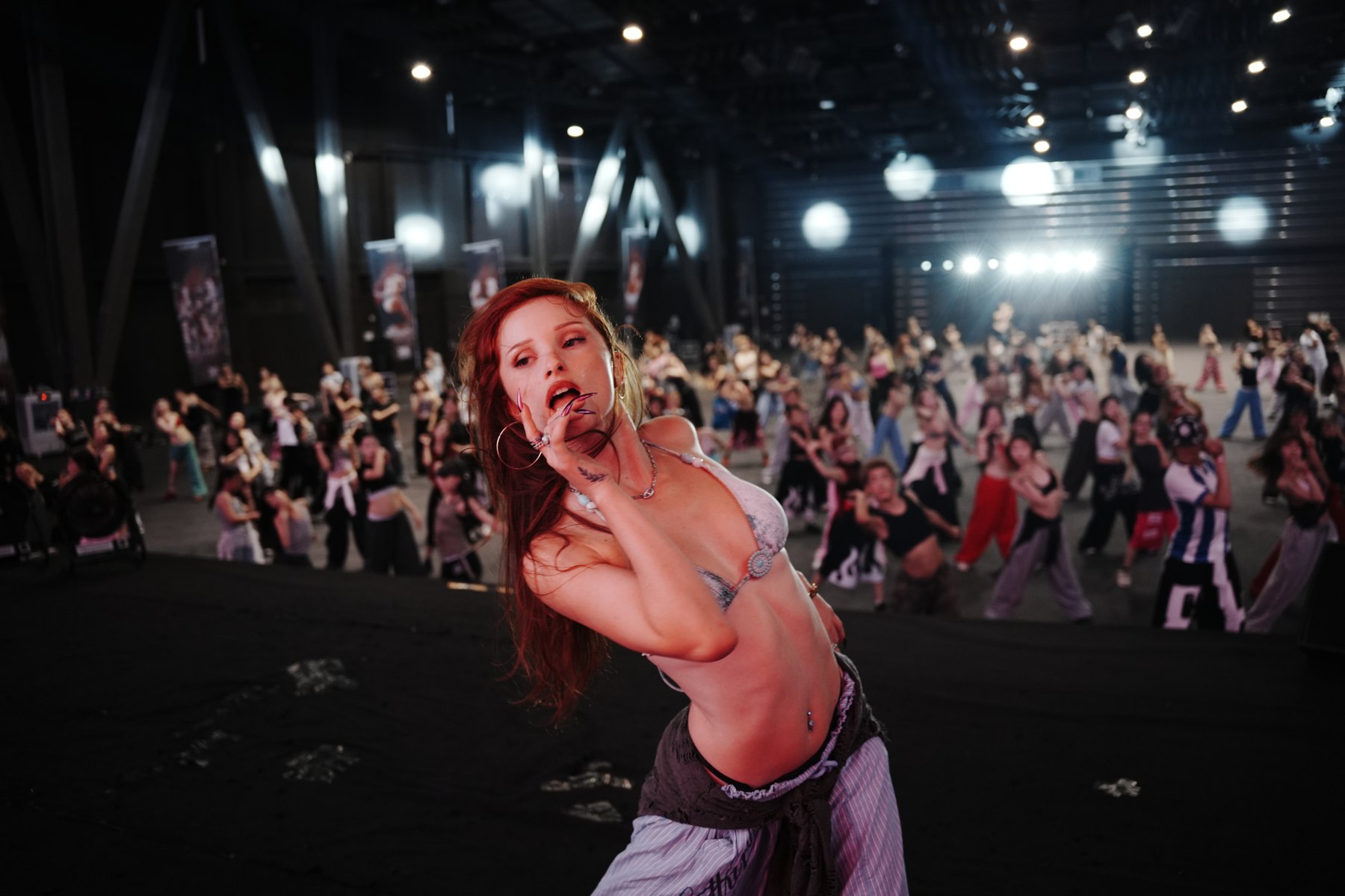 A teacher demonstrating movement in front of the NOVA class
